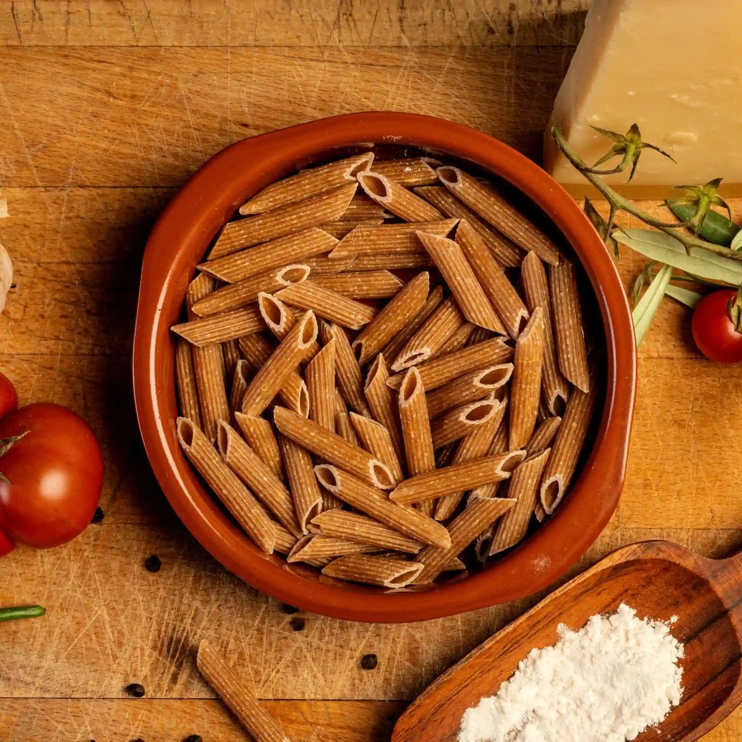 Top view of multiple pieces of uncooked Organic Einkorn Penne